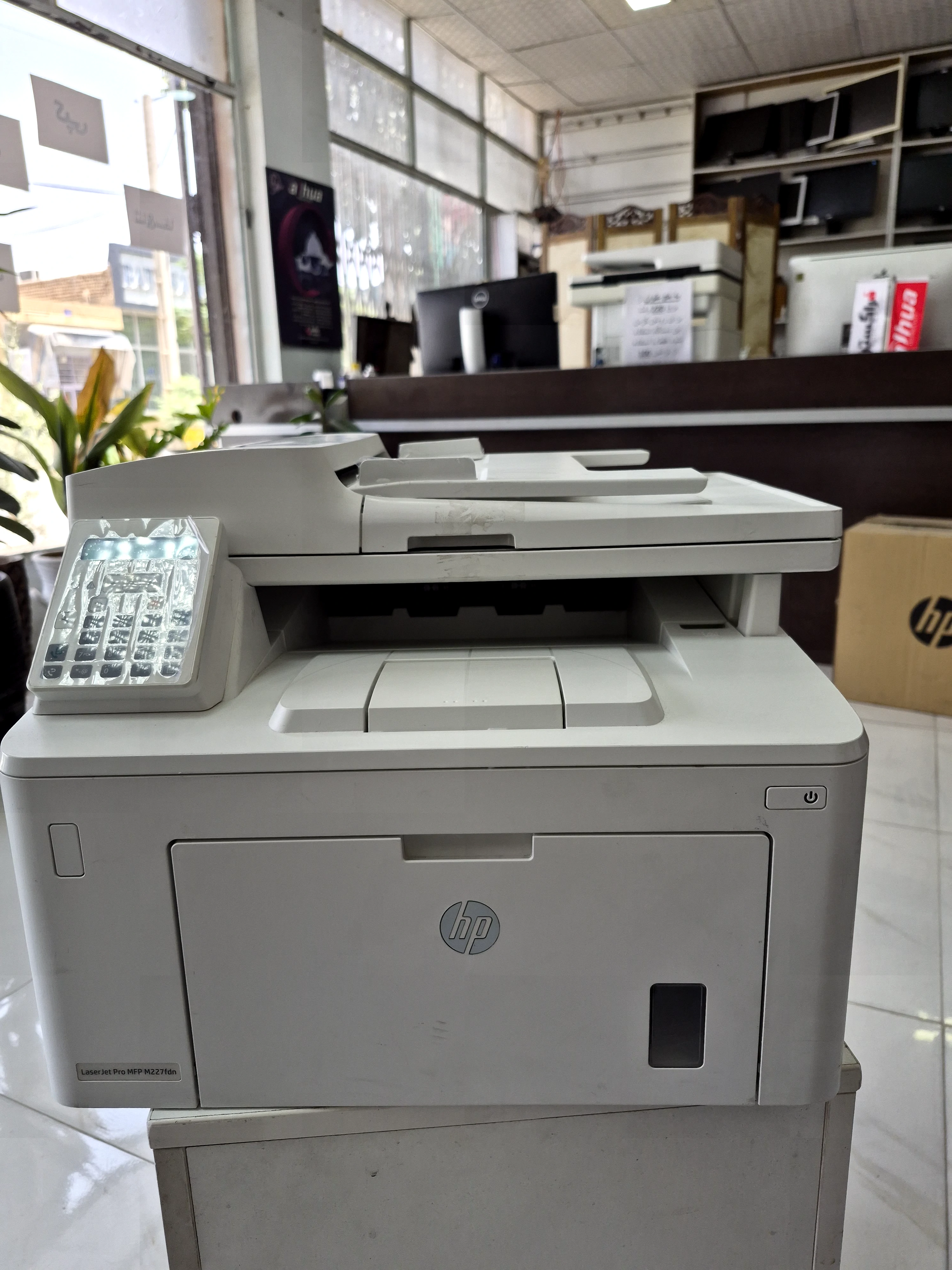 خرید پرینتر استوک اچ پی تک رنگ چهار کاره‌ با چاپ لیزری مدل LaserJet Pro MFP M227fdn، سایز چاپ A4، قابلیت‌ اتصال به WiFi